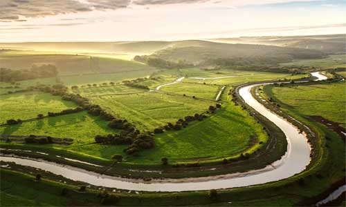 An aerial view showing a river in Wealden