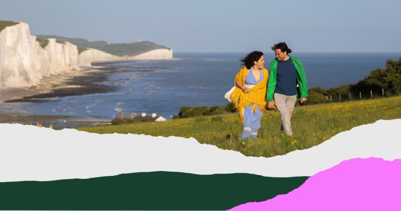 People walking with the Seven Sisters in the background